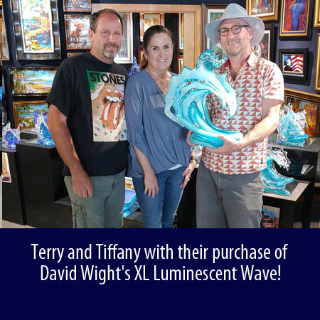 Terry and Tiffany with their purchase of David Wight's XL Luminescent Wave at Wyland Gallery Sarasota