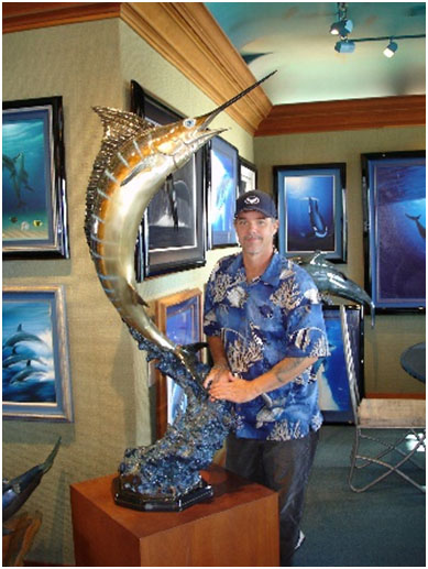 Wyland with one of his large Marlin bronze sculpture