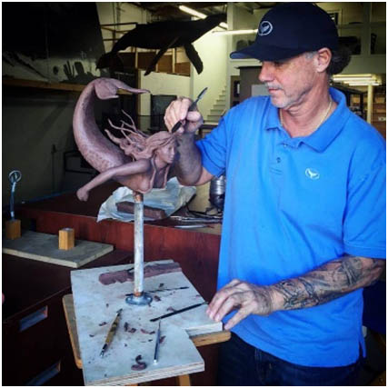 Wyland working on a bronze sculpture - Mermaid Below