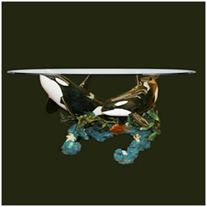 orca below dining table by Wyland - bronze sculpture table