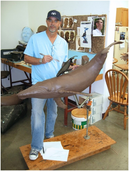 Wyland working on a bronze sculpture for a table