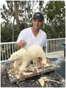 Wyland working on a lucite sculpture.