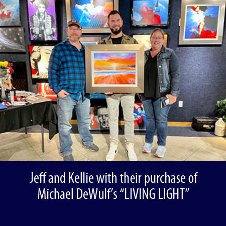 Jeff and Kellie with their purchase of Michael DeWulfs LIVING LIGHT Wyland Galleries