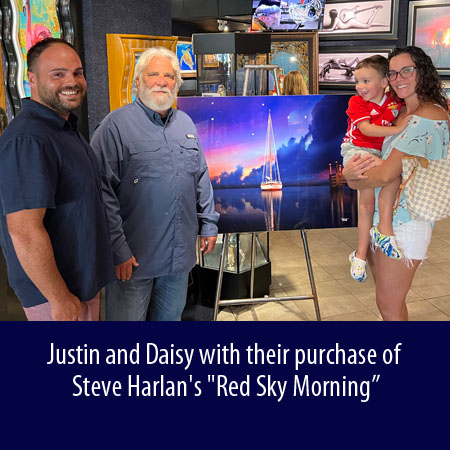 Justin and Daisy with their purchase of Steve Harlan's Red Sky Morning